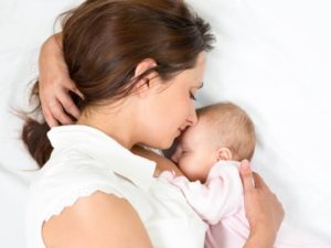 nursing mom bonding with baby
