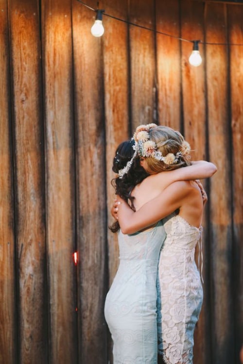 Bride and Maid of Honor hugging